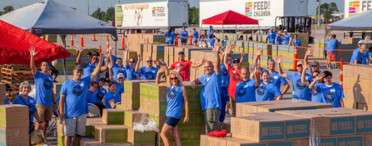A group of volunteers at an outdoor box event