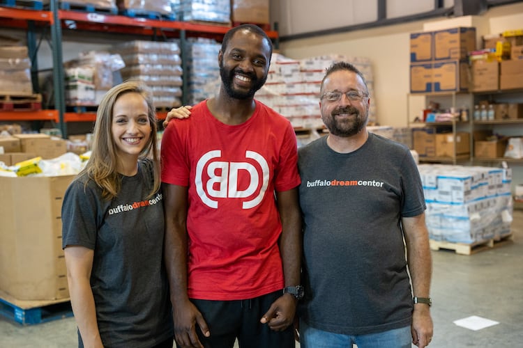 Dezmond and Emilie in a warehouse