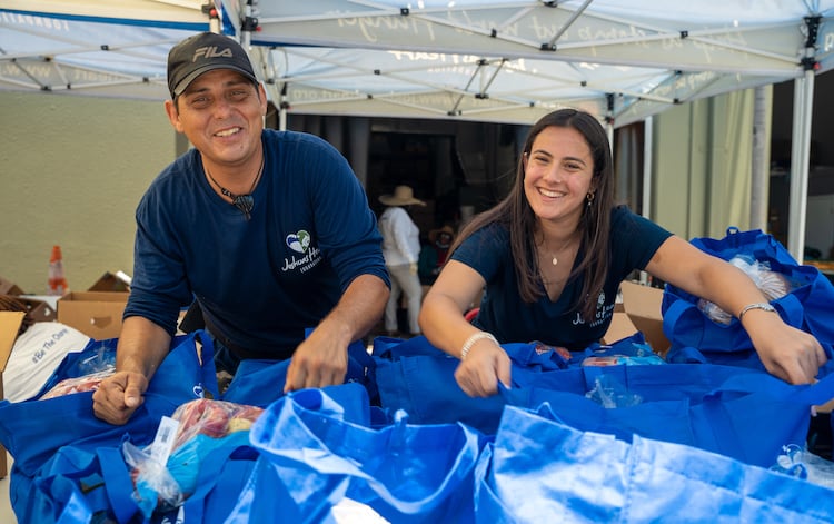 Konner with a volunteer at an event