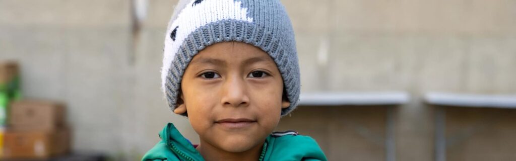 A boy in winter clothing outdoors