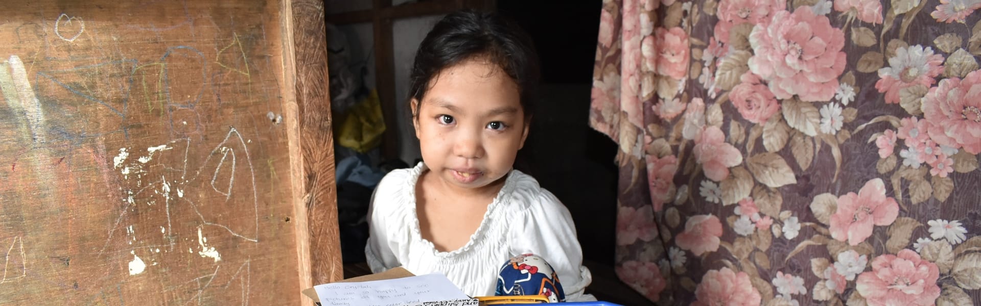 A child sitting indoors