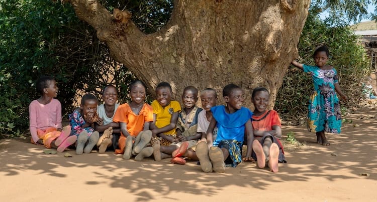 Children sitting together outdoors