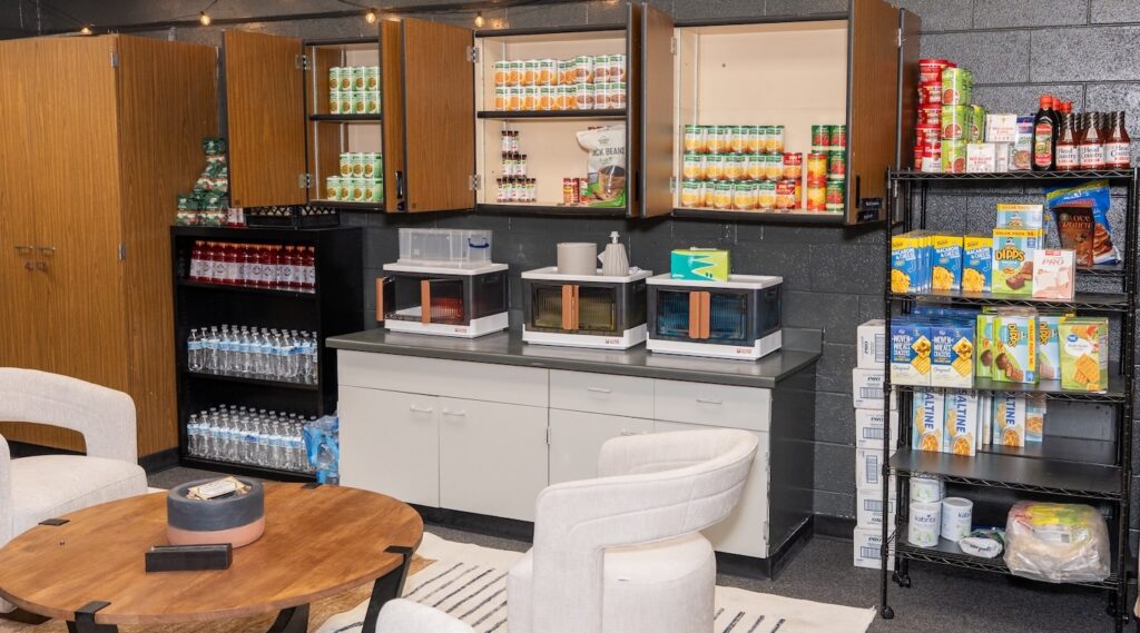 A pantry full of food in a school supply room.